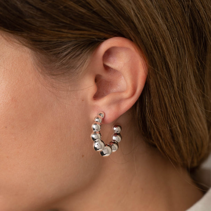 Sølv store øreringe fås i guld og sølv sisi copenahgen smykker bestil online.
