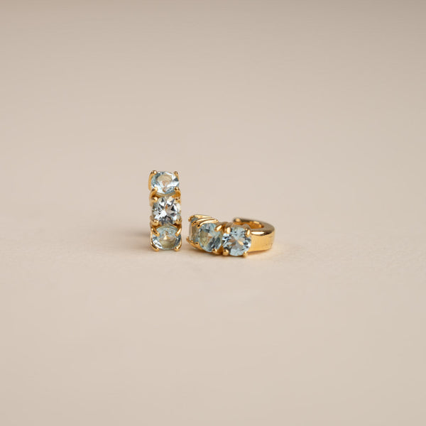 GEMMA BLUE TOPAZ GOLDEN HUGGIE EARRING